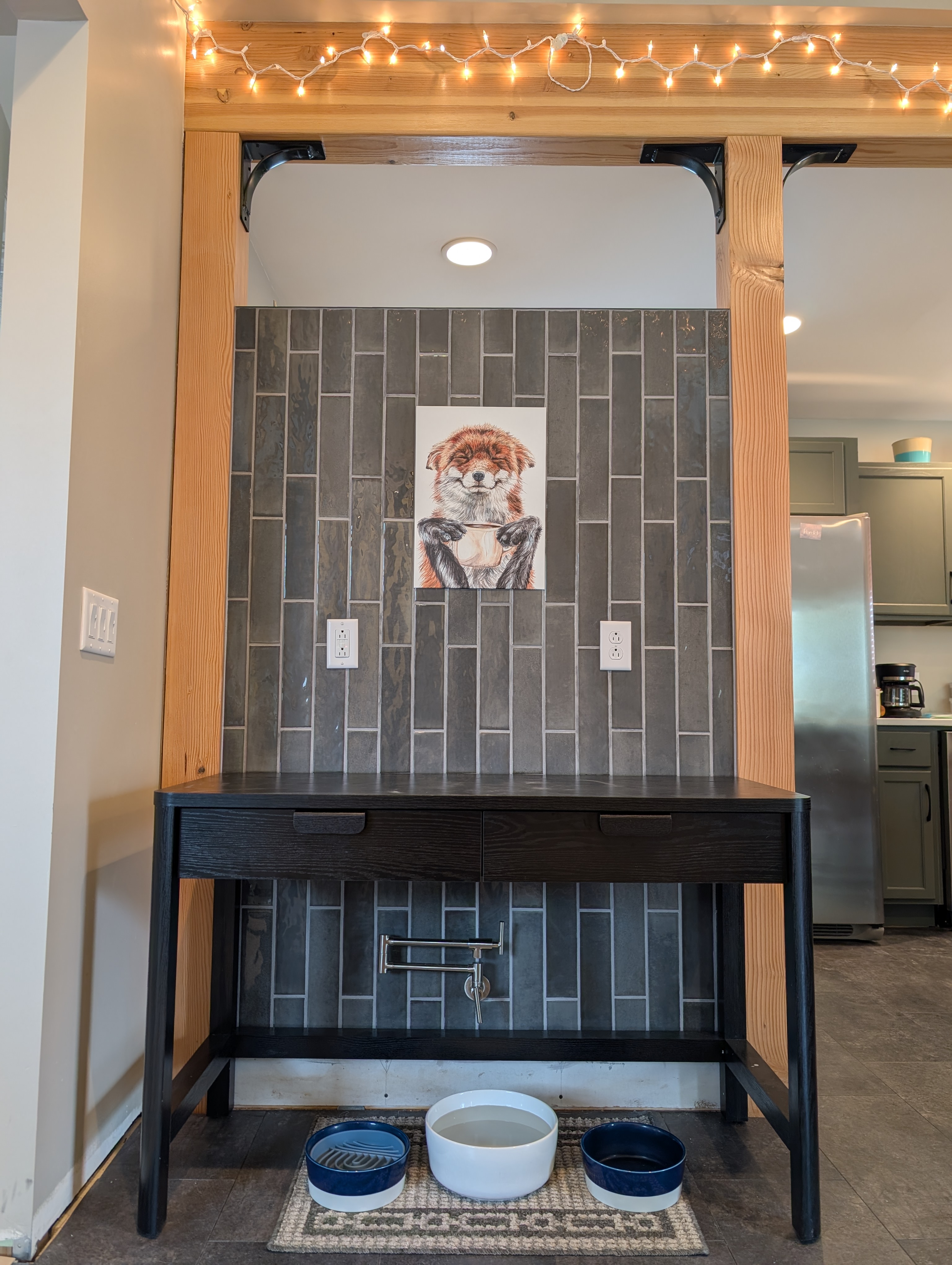 Dark vertical-stack tile on custom coffee bar niche in Omaha home